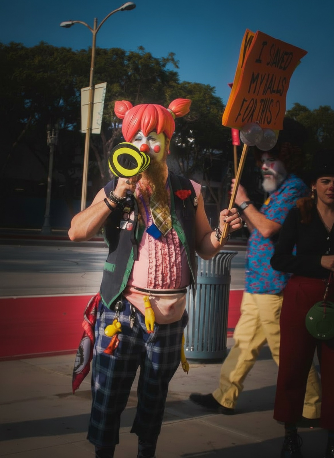 Clown with megaphone at a street protest